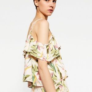 Frilly cold shoulder tropical top
